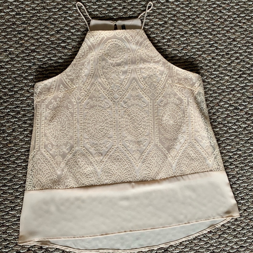 Cream colored tank top with embroidered detailing